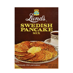 Lund's Swedish Pancake Mix packaging on a kitchen counter, premium quality for authentic taste.