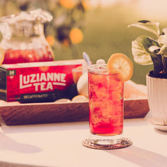 Tall glass of Luzianne Decaf Iced Tea poured over ice
