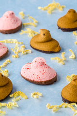 LYZA'S Peeps Delights strawberry chicks show soft marshmallow with chocolate finish.