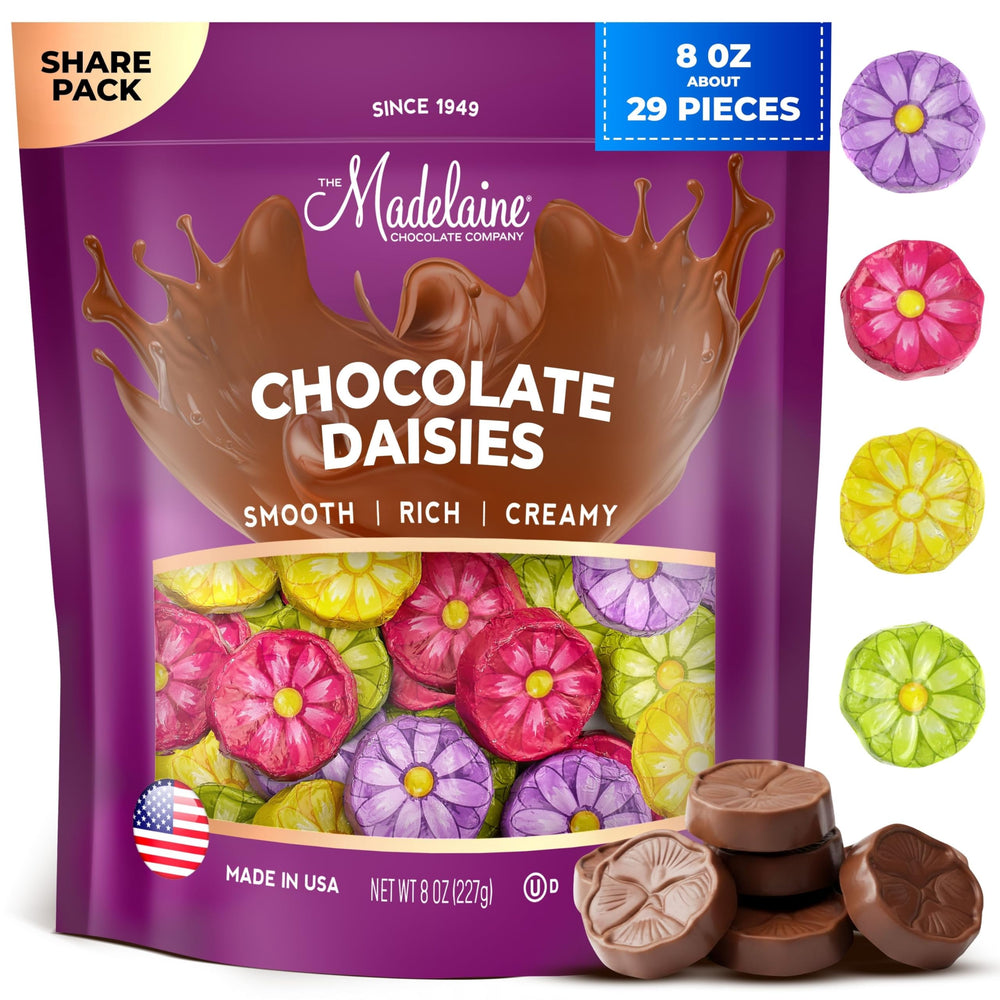 Madelaine solid milk chocolate with gerbera daisies wrapped in Italian foil, ideal for gifting.
