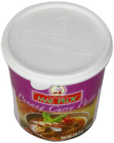 Mae Ploy Panang paste tub close-up, rich aroma for authentic Thai curry at home.