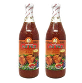 Mae Ploy Sweet Chilli Sauce bottle pour showing versatile dipping and glazing.