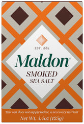 Maldon smoked sea salt flakes close-up; pyramid texture for seafood finishing.