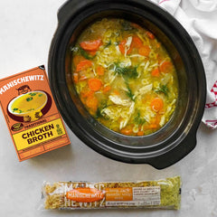 Manischewitz chicken broth simmering in a pot creates a rich base