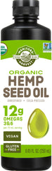 Manitoba Harvest organic hemp oil bottle ready to drizzle over a salad.