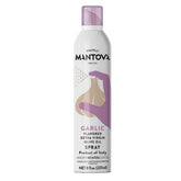 Mantova Garlic Flavored EVOO Spray bottle pouring a light drizzle on dish