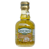 Mantova Garlic Grand'Aroma olive oil bottle pouring over pasta for bright Italian flavor.