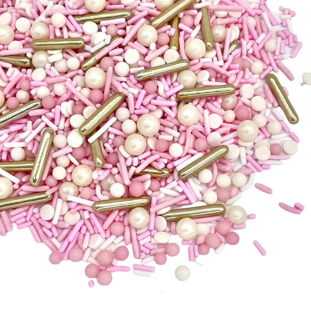 Manvscakes rose gold pink sprinkles topping adds festive sparkle to cakes.