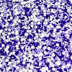 Close-up of Manvscakes sprinkles featuring jimmies and nonpareils for rich texture.