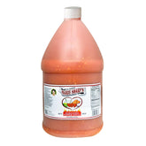 Marie Sharp's Hot Habanero bottle on kitchen shelf highlighting Belizean flavor