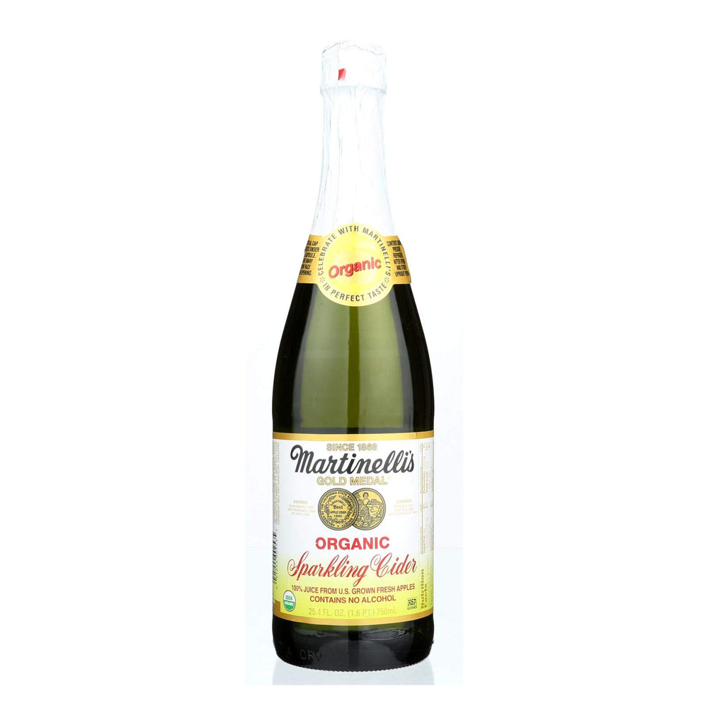 Martinelli's Sparkling Cider bottle pour captures crisp apple bubbles for festive moments.