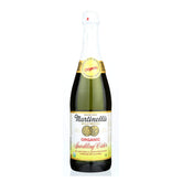 Martinelli's Sparkling Cider bottle pour captures crisp apple bubbles for festive moments.