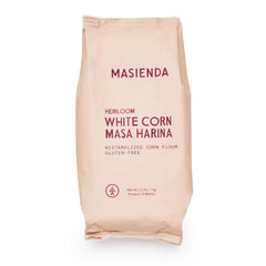 Masienda Heirloom White Corn Masa Harina bag shown on a wooden surface for authentic tortillas and tamales.