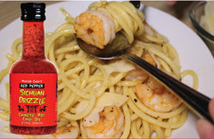 Ingredients and oils swirl in Master Chen's Sichuan Drizzle, highlighting premium flavor blends.