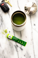 A warm cup of Matcha LOVE hot tea with a rich aroma.