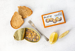 Matiz Spanish berberechos small clams, brined for convenient, fresh bites.