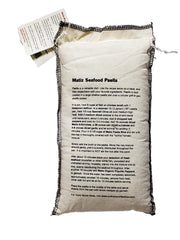 Matiz Valenciano paella rice cooking in a pot for flavorful base.