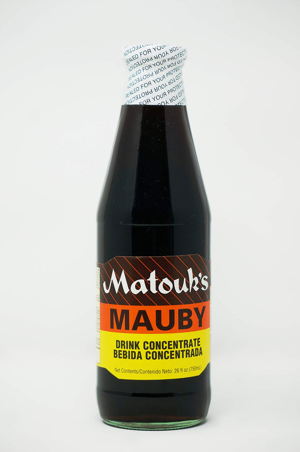 Matouk's Mauby 26oz bottle on table, ready for a refreshing sip.