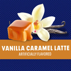 Scooping Maxwell House mix into hot water to create a creamy vanilla caramel latte
