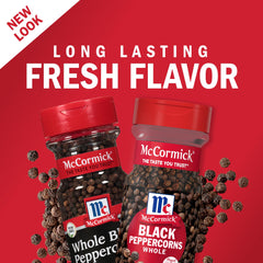 McCormick whole peppercorns on spice shelf in a practical kitchen setting
