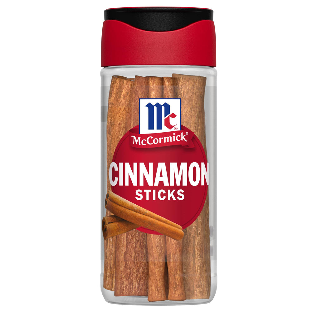 McCormick Cinnamon Sticks bottle on kitchen shelf for warm flavor during cooking.
