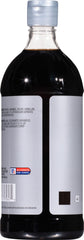 Pouring McCormick Culinary Imitation Vanilla Flavor for desserts
