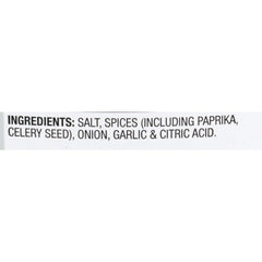 Pouring McCormick Rotisserie Chicken Seasoning over poultry for even, savory flavor