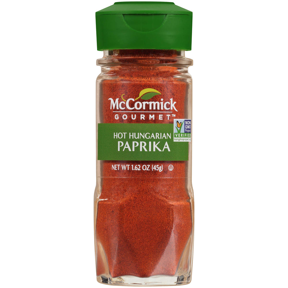 McCormick Gourmet Hot Hungarian Paprika bottle pour highlighting bold color and heat