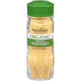 McCormick Gourmet Organic Ground Mustard bottle pour adds bold heat to sauces.