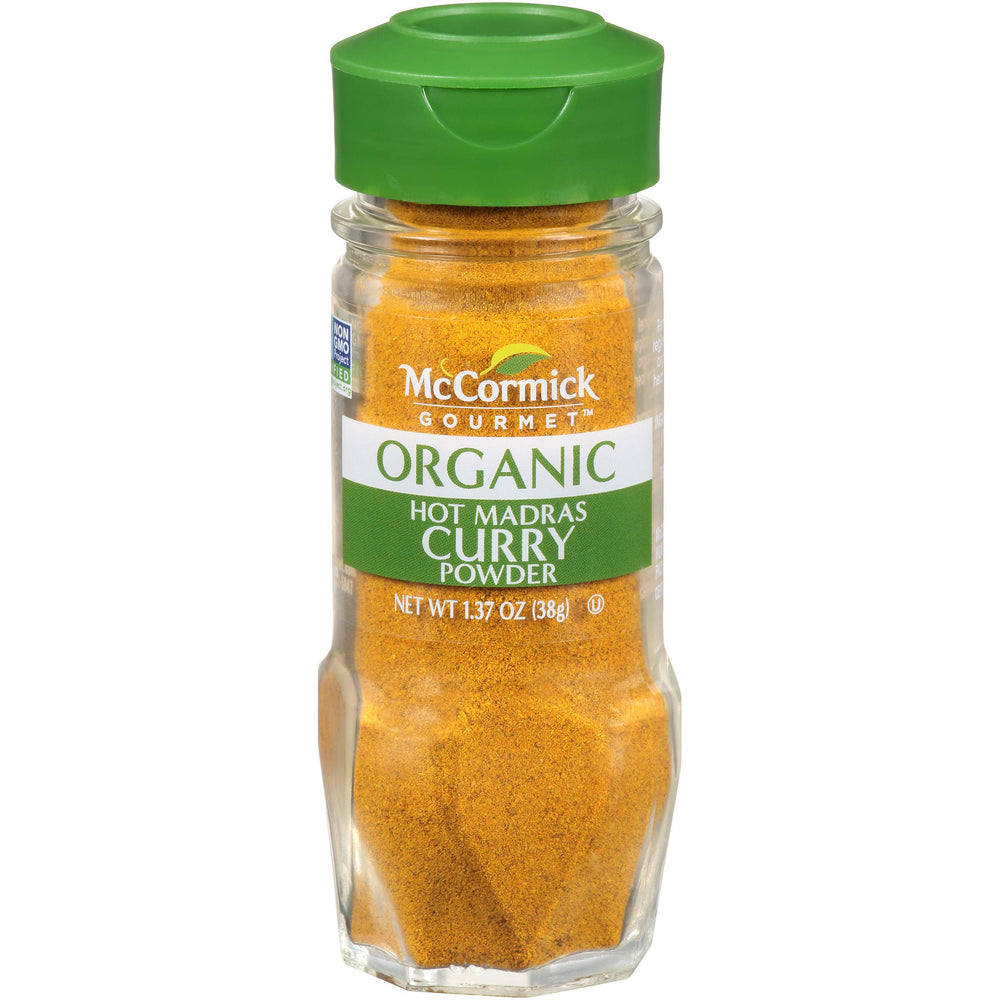 McCormick Gourmet Organic Hot Madras curry powder bottle pour adds bold flavor to curries