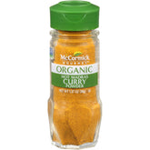 McCormick Gourmet Organic Hot Madras curry powder bottle pour adds bold flavor to curries