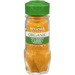 McCormick Gourmet Organic Hot Madras curry powder bottle pour adds bold flavor to curries