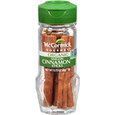 McCormick Gourmet Organic Saigon Cinnamon sticks on a wooden surface for rich aroma