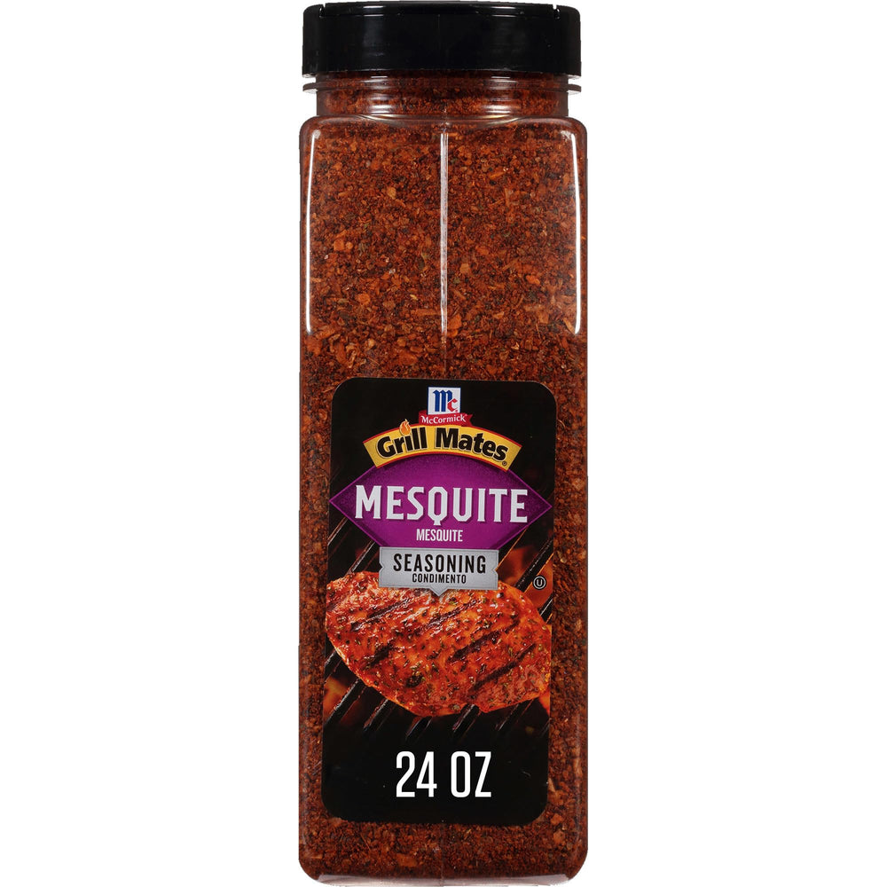 McCormick Grill Mates Mesquite Seasoning bottle being poured for flavorful grilling.