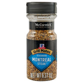 McCormick Grill Mates Montreal steak seasoning bottle pour enhances grilling flavor.