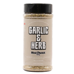 Meat Church Garlic & Herb seasoning on meat; 12 oz bottle; gluten-free.