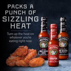 Close-up pour of Melinda's Extreme Fiery Pack bottles for flavor exploration.