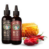 Melinda’s Hot Honey collection 2-pack on display showing classic and ghost varieties for versatile use.