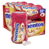 Mentos Pure Fresh Cinnamon bottle on desk for on-the-go freshness.
