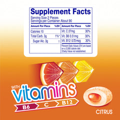 Mentos Vitamins Citrus gum piece closeup highlighting crunchy shell and soft center.