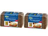 Mestemacher whole grain pumpernickel bread loaf on cutting board, fiber-rich and perfect for wholesome toast.