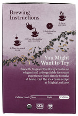 Mighty Leaf ceramic mug with Earl Grey steam shows a comforting tea moment.