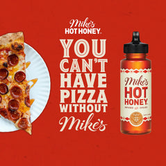 Mike's Hot Honey drizzle on a cheese board for balanced sweetness