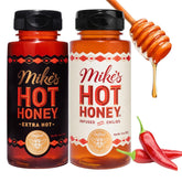 Mike's Hot Honey Original bottle pouring, versatile drizzle for pizza and cheese boards.