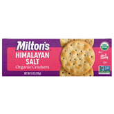 Milton's Craft Bakers Organic Himalayan Salt crackers on a charcuterie board with cheese.