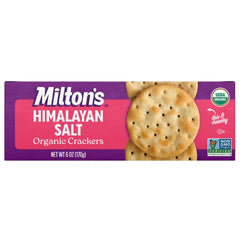 Milton's Craft Bakers Organic Himalayan Salt crackers on a charcuterie board with cheese.