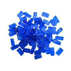 Closeup of vibrant blue raspberry candies from MIMA MIMA with glossy surfaces.
