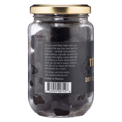 Mina dry cured black olives on appetizer plate for entertaining