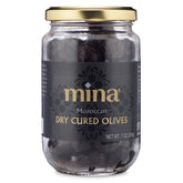 Mina dry cured black olives in a jar closeup highlighting natural flavor