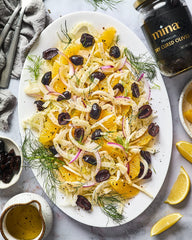 Mina dry cured black olives served in a bowl ideal as antipasto or salad topping